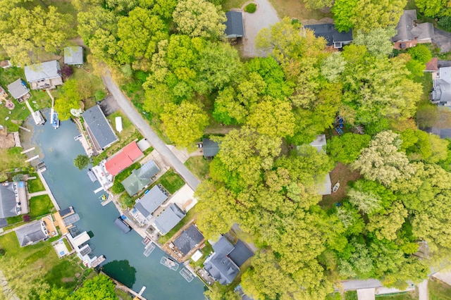 aerial overview of property's location featuring a large body of water and nearby suburban area