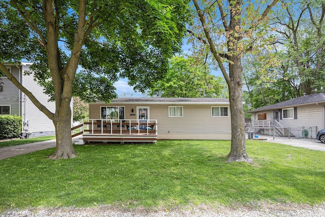 44080 Davis, Utica, MI 48317 - single story home featuring a wooden deck and a front yard
