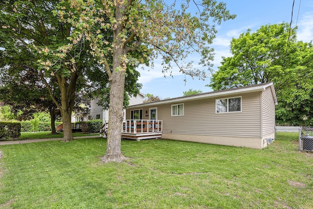 44080 Davis, Utica, MI 48317 - rear view of house with a deck