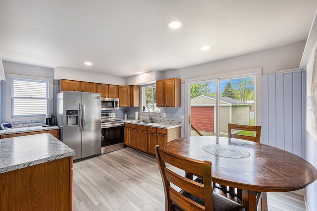 44080 Davis, Utica, MI 48317 - kitchen featuring stainless steel appliances, a sink, brown cabinetry, light countertops, and recessed lighting