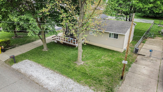 44080 Davis, Utica, MI 48317 - view of front facade featuring roof with shingles, a wooden deck, and cooling unit