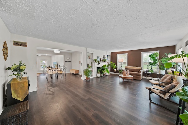 608 Budlong St, Adrian, MI 49221 - living room featuring a textured ceiling and wood finished floors