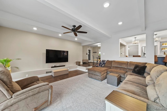 608 Budlong St, Adrian, MI 49221 - living area with beamed ceiling, dark wood-type flooring, recessed lighting, baseboards, and a chandelier