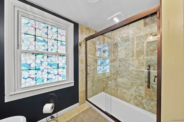 608 Budlong St, Adrian, MI 49221 - full bath with tile patterned flooring, a shower stall, healthy amount of natural light, and baseboards