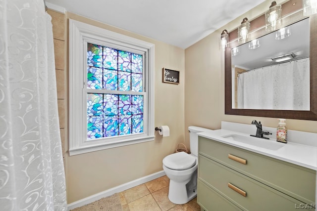 608 Budlong St, Adrian, MI 49221 - bathroom featuring baseboards, tile patterned floors, toilet, and vanity