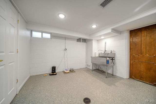 608 Budlong St, Adrian, MI 49221 - basement featuring concrete block wall and recessed lighting