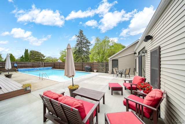 608 Budlong St, Adrian, MI 49221 - view of swimming pool featuring outdoor lounge area, a fenced backyard, a patio area, and a wooden deck