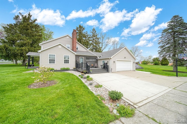 608 Budlong St, Adrian, MI 49221 - view of front of property with an attached garage, driveway, a front yard, and a chimney