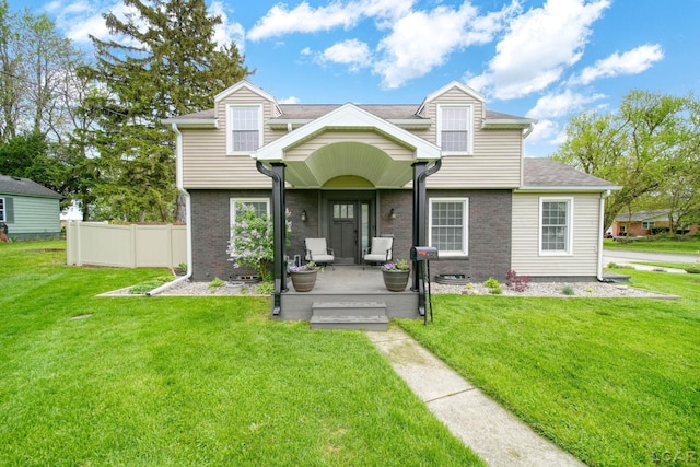 608 Budlong St, Adrian, MI 49221 - view of front facade featuring brick siding and a porch