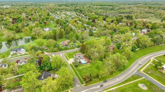 608 Budlong St, Adrian, MI 49221 - aerial overview of property's location featuring a nearby body of water and a heavily wooded area