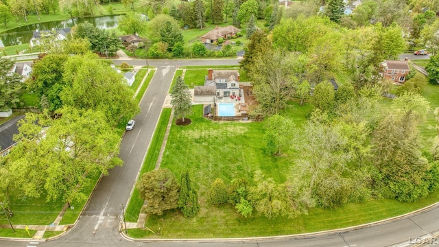 608 Budlong St, Adrian, MI 49221 - aerial view of a nearby body of water and a tree filled landscape