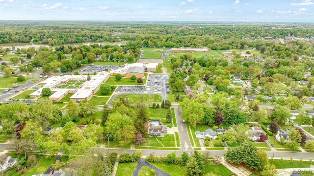 608 Budlong St, Adrian, MI 49221 - aerial view of property's location featuring a heavily wooded area