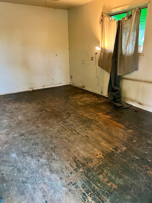 spare room with hardwood / wood-style floors