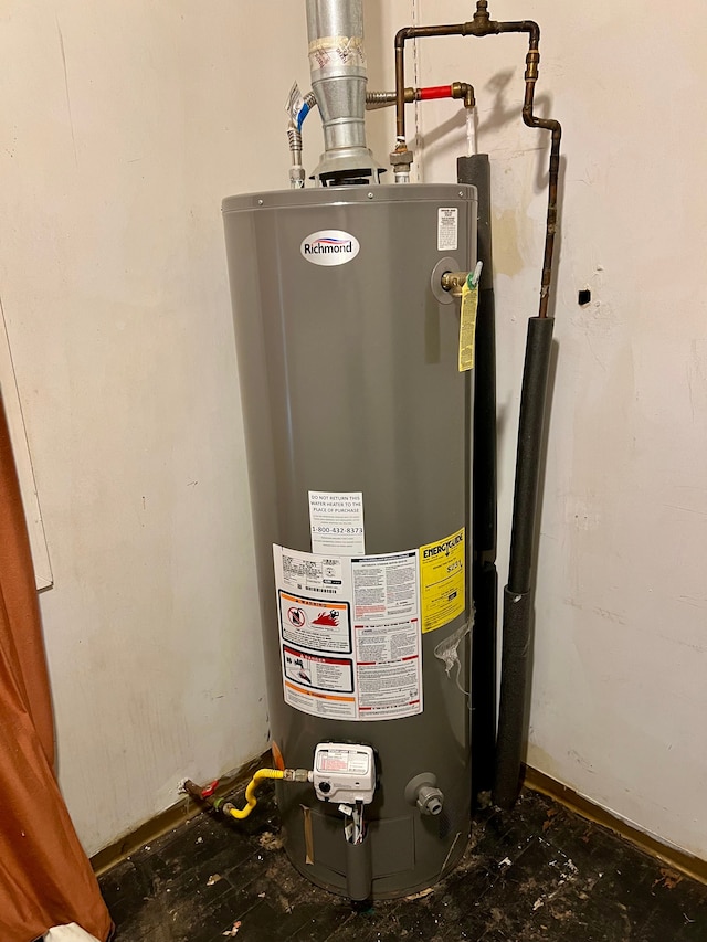 utility room featuring water heater