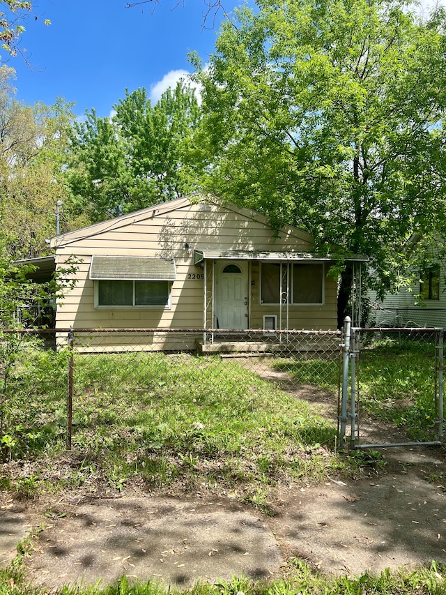 2209 Kansas Ave, Flint, MI 48506 - view of front of home featuring a gate