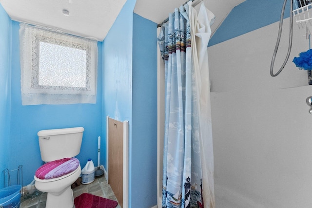 512 Kalkaska Rd NW, Kalkaska, MI 49646 - full bath with a shower with curtain and toilet