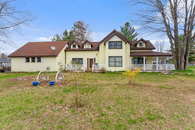 512 Kalkaska Rd NW, Kalkaska, MI 49646 - back of property featuring a lawn and a porch