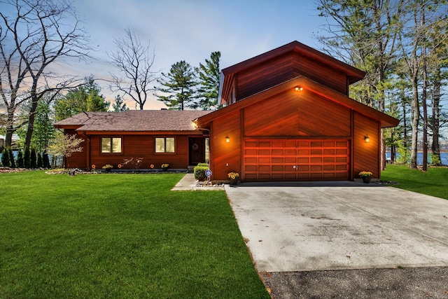 7017 Loud Dr, Oscoda, MI 48750 - view of front of home with driveway and a lawn