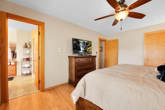 7017 Loud Dr, Oscoda, MI 48750 - bedroom featuring light wood-style floors, baseboards, and a ceiling fan