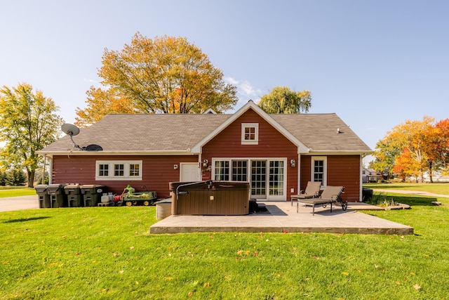 3694 Kerlikowske Rd, Coloma, MI 49038 - rear view of property featuring a hot tub, a patio area, a lawn, and roof with shingles