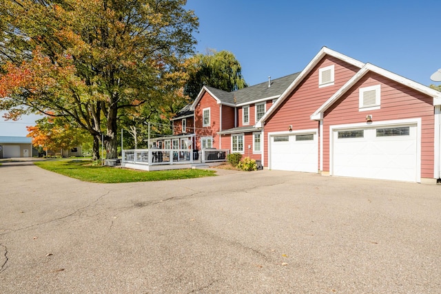 3694 Kerlikowske Rd, Coloma, MI 49038 - traditional-style home featuring driveway, a garage, and a deck