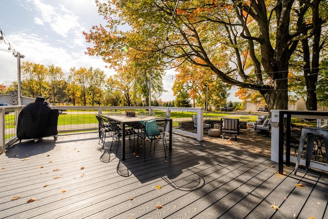 3694 Kerlikowske Rd, Coloma, MI 49038 - deck with outdoor dining space and a grill