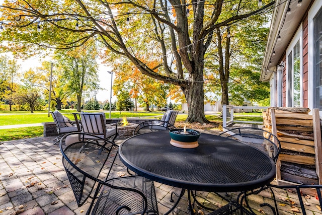 3694 Kerlikowske Rd, Coloma, MI 49038 - view of patio featuring an outdoor fire pit and outdoor dining space