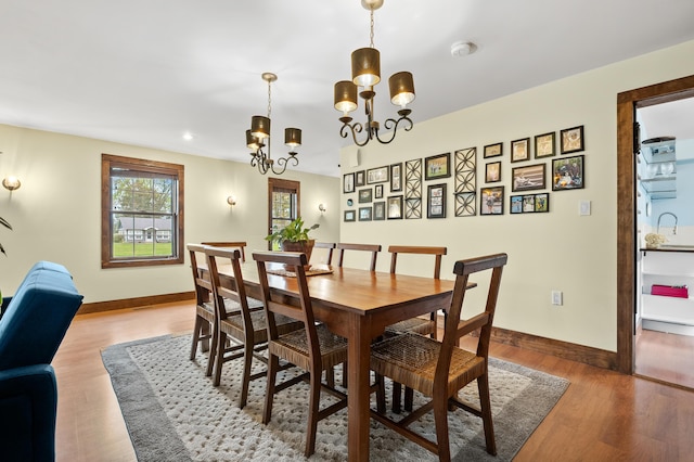 3694 Kerlikowske Rd, Coloma, MI 49038 - dining area featuring light wood-style flooring, baseboards, a chandelier, and recessed lighting
