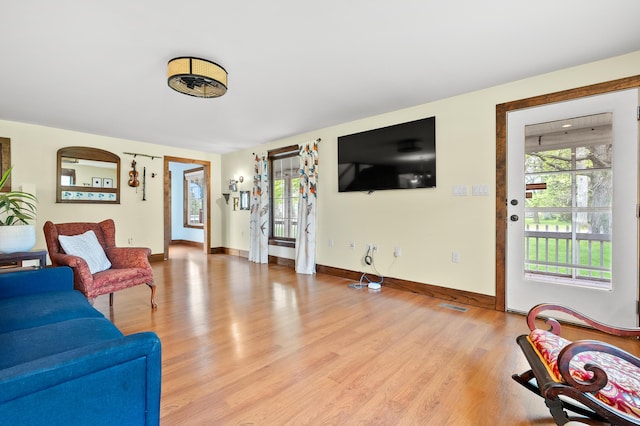 3694 Kerlikowske Rd, Coloma, MI 49038 - living room with light wood-style flooring, healthy amount of natural light, and baseboards