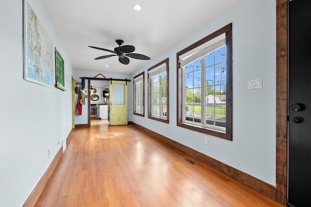 3694 Kerlikowske Rd, Coloma, MI 49038 - entrance foyer featuring a barn door, baseboards, light wood-style floors, recessed lighting, and ceiling fan