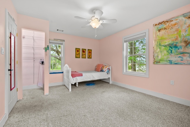 3694 Kerlikowske Rd, Coloma, MI 49038 - bedroom featuring carpet flooring, multiple windows, baseboards, and a ceiling fan