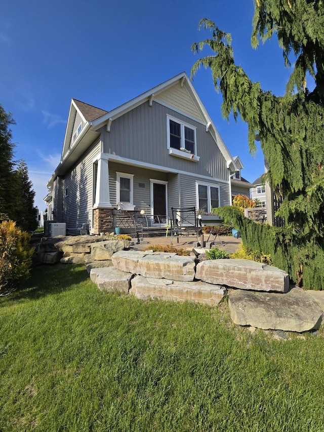 7251 E Beach Dr, South Haven, MI 49090 - back of house featuring a yard