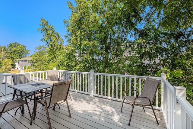 7251 E Beach Dr, South Haven, MI 49090 - wooden terrace featuring outdoor dining space