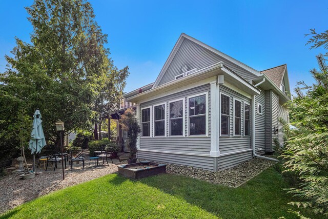 7251 E Beach Dr, South Haven, MI 49090 - view of home's exterior with a yard and a patio