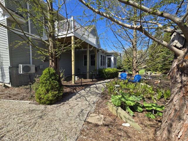 7251 E Beach Dr, South Haven, MI 49090 - view of property exterior with a wooden deck and cooling unit