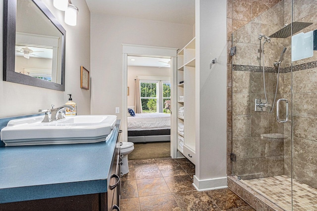 7251 E Beach Dr, South Haven, MI 49090 - ensuite bathroom with vanity, a stall shower, ceiling fan, and baseboards