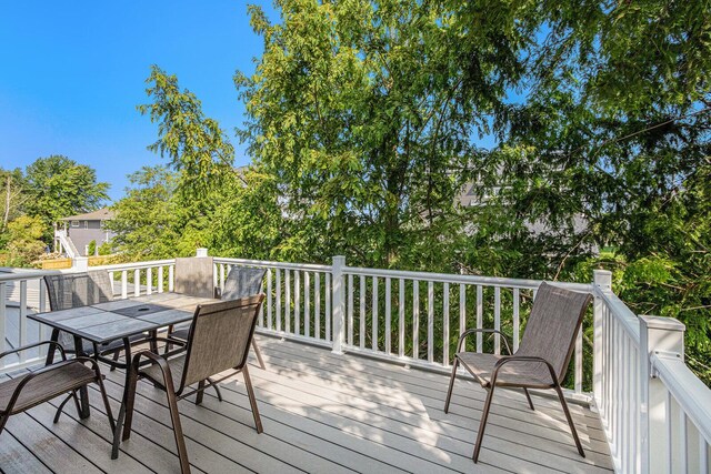 7251 E Beach Dr, South Haven, MI 49090 - wooden terrace featuring outdoor dining area