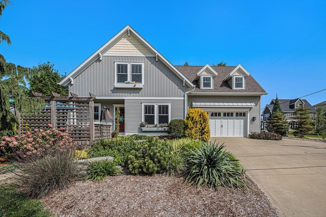 7251 E Beach Dr, South Haven, MI 49090 - view of front of property with an attached garage, driveway, and board and batten siding
