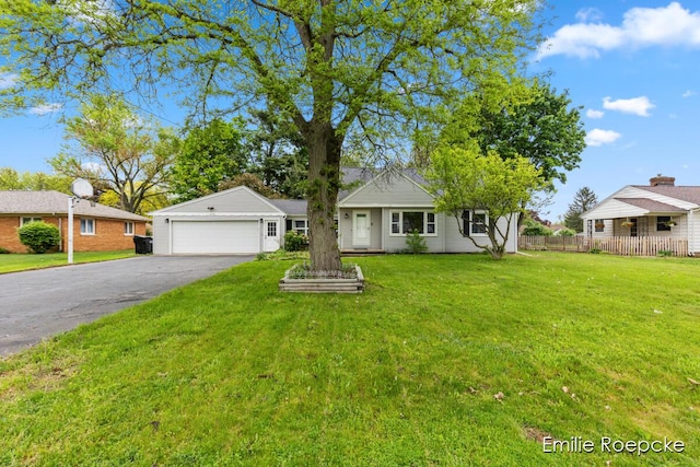 8131 Lorac St, Portage, MI 49002 - single story home with asphalt driveway and a garage