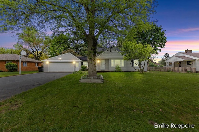 8131 Lorac St, Portage, MI 49002 - view of front facade with asphalt driveway and an attached garage