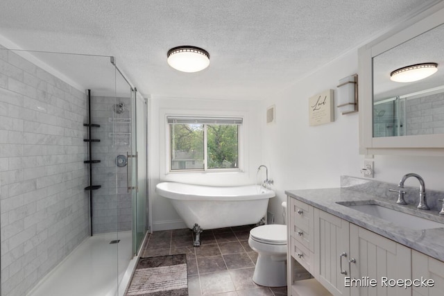 8131 Lorac St, Portage, MI 49002 - bathroom featuring a shower stall, vanity, a soaking tub, a textured ceiling, and toilet