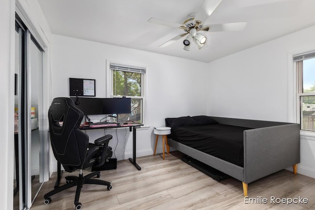8131 Lorac St, Portage, MI 49002 - bedroom featuring light wood finished floors, an office area, and baseboards