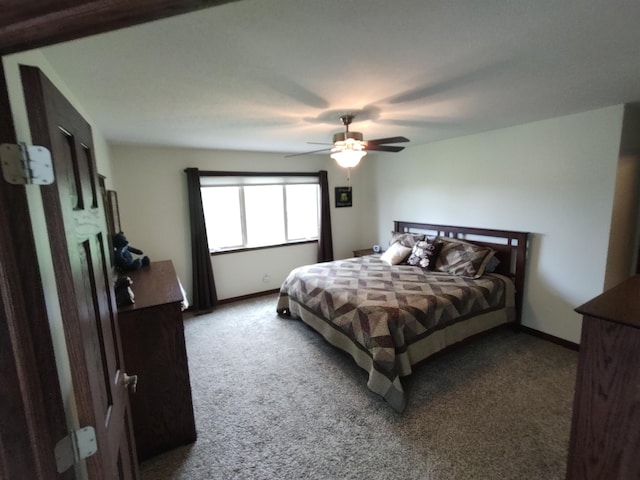 bedroom with carpet flooring, baseboards, and a ceiling fan