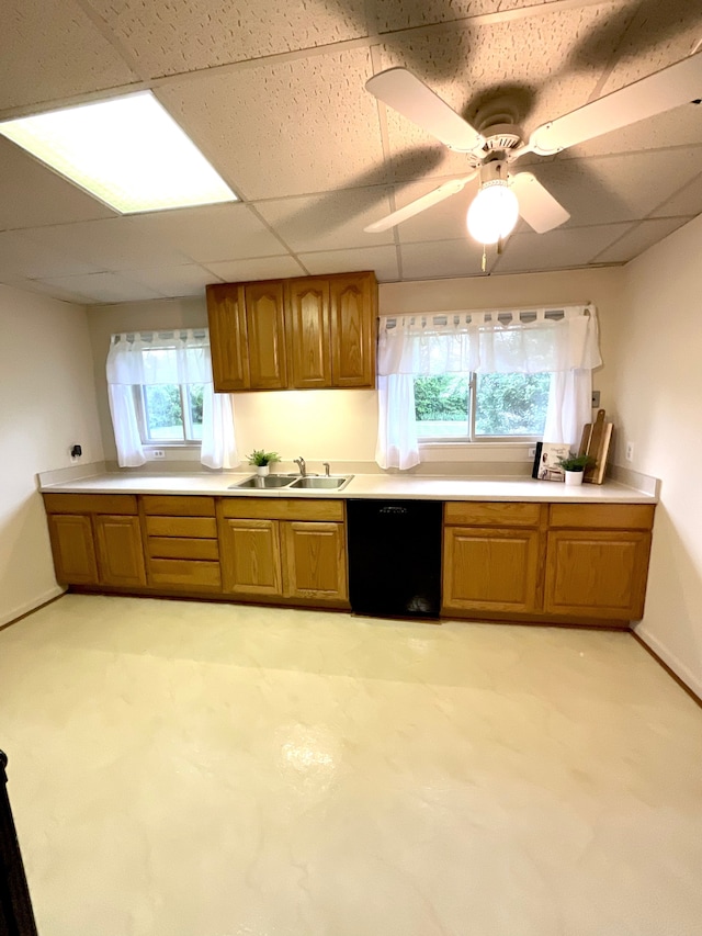 5817 Everest Dr, Clarkston, MI 48346 - kitchen with dishwasher, a sink, brown cabinetry, light countertops, and a paneled ceiling