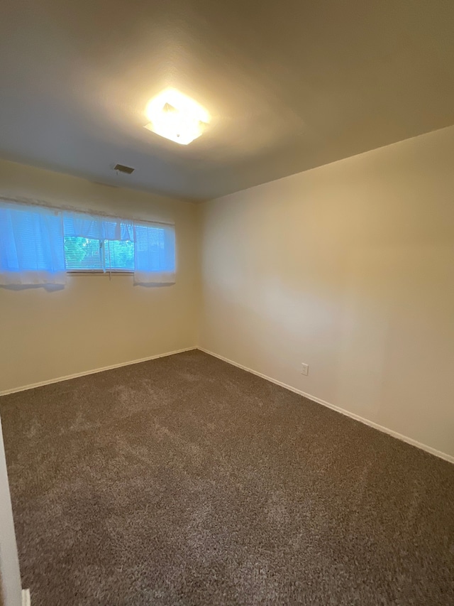 5817 Everest Dr, Clarkston, MI 48346 - unfurnished room featuring dark carpet and baseboards