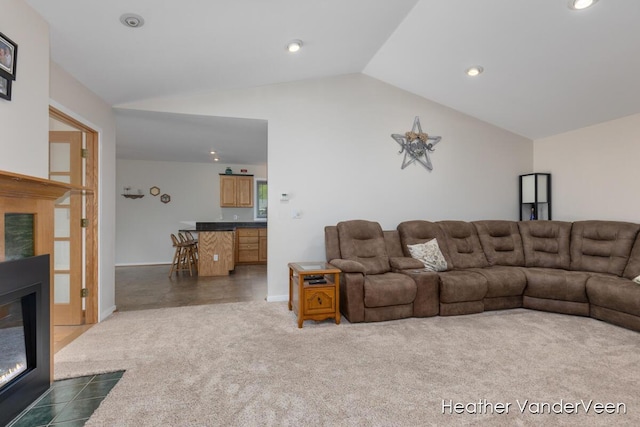 living room with lofted ceiling, dark carpet, recessed lighting, a fireplace with flush hearth, and baseboards