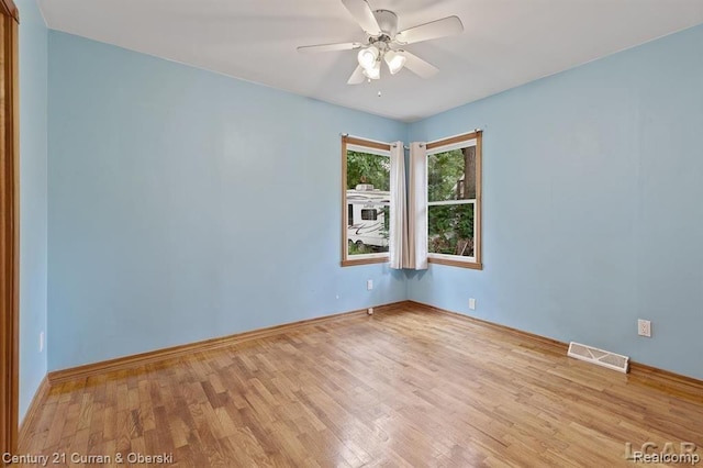 117 Studer Dr, Grass Lake, MI 49240 - spare room with light wood-style floors, ceiling fan, and baseboards
