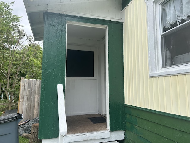 172 Goguac St W, Battle Creek, MI 49015 - doorway to property featuring fence