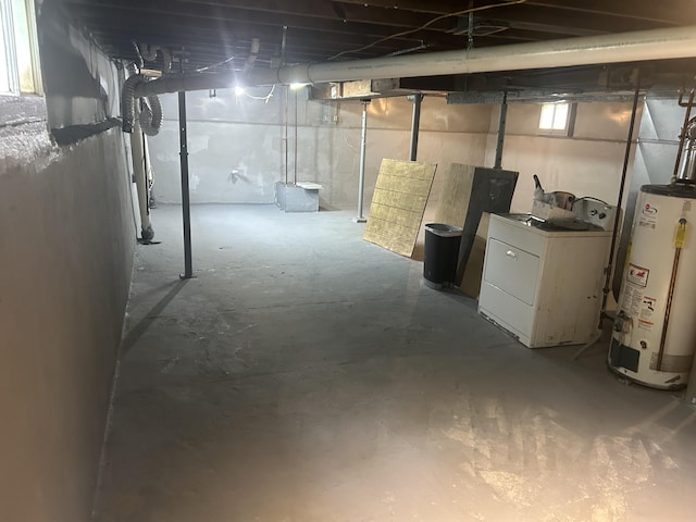 172 Goguac St W, Battle Creek, MI 49015 - basement with gas water heater, washer / clothes dryer, and plenty of natural light