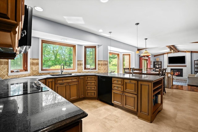 6588 White Pines Dr, Brighton, MI 48116 - kitchen with black appliances, brown cabinets, a peninsula, healthy amount of natural light, and recessed lighting